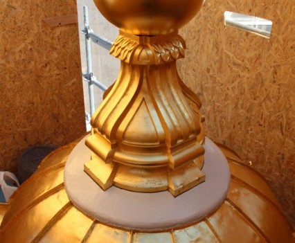 first-cross-and-cupola-finished-with-cement-base-painted