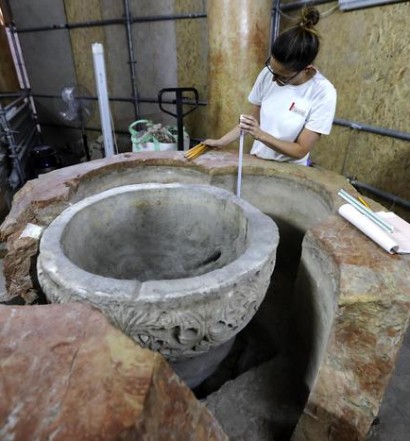 epa07665978 Archeologists work at the site where a Byzantine baptism font was discovered during restoration work at the Church of the Nativity, in Bethlehem, 22 June 2019. According to reports, head of the Palestinian Committee in charge of the Church restoration Ziad al-Bandak announced the discovery of a baptismal font during the restoration work of the Church of the Nativity that is probably dating back to 6th century AD.  EPA/ABED AL HASHLAMOUN